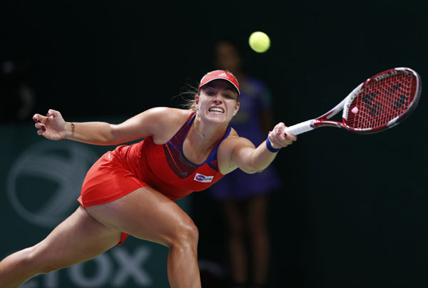 Angelique Kerber of Germany hits a return to Agnieszka Radwanska of Poland during their WTA tennis championships match at Sinan Erdem Dome in Istanbul, Oct 24, 2013. Li Na nears her first WTA finale semis